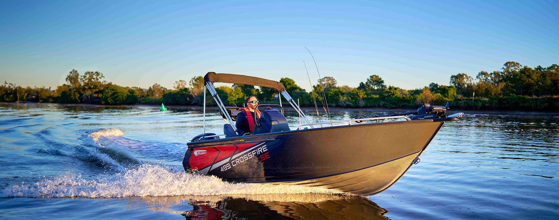 Stacer motorboat cruising on open water